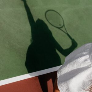 shadow of woman playing tennis