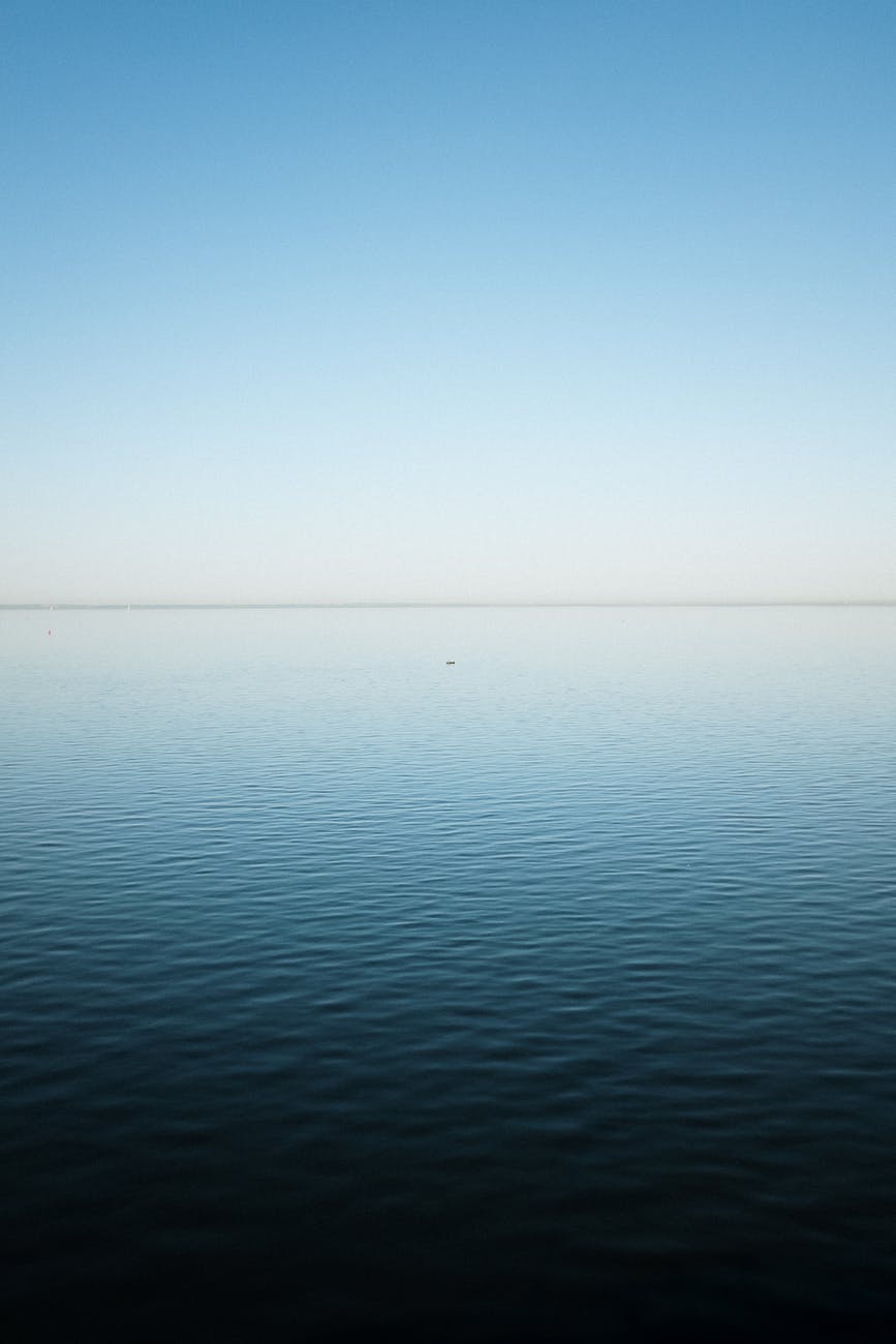 calm sea under blue sky
