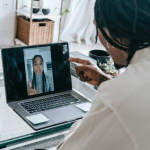stressed black couple having video call via laptop