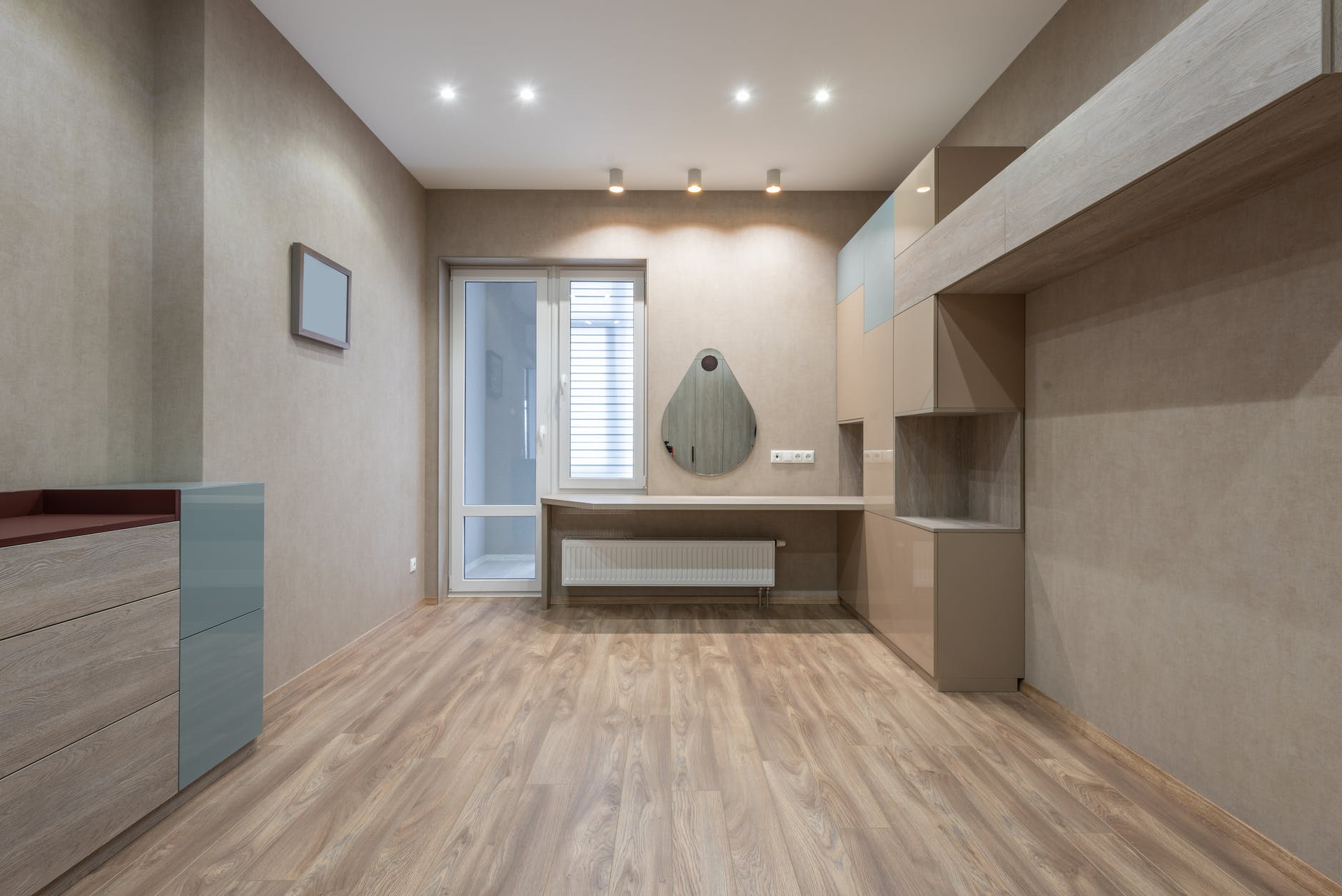 spacious room with cupboards and door