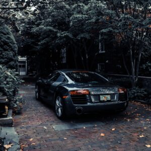 photo of audi parked near trees