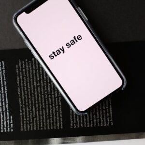smartphone with stay safe title on open magazine