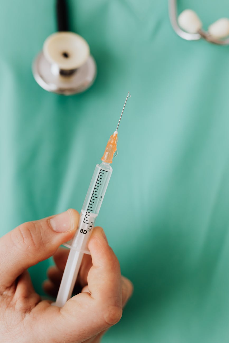 close up view of person holding a vaccine