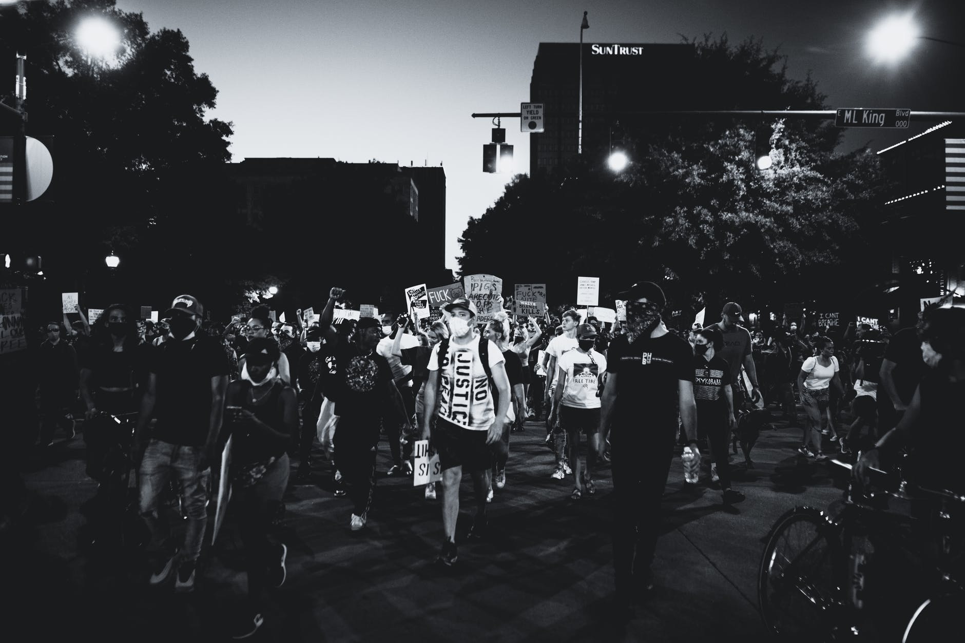 grayscale photo of people walking on street