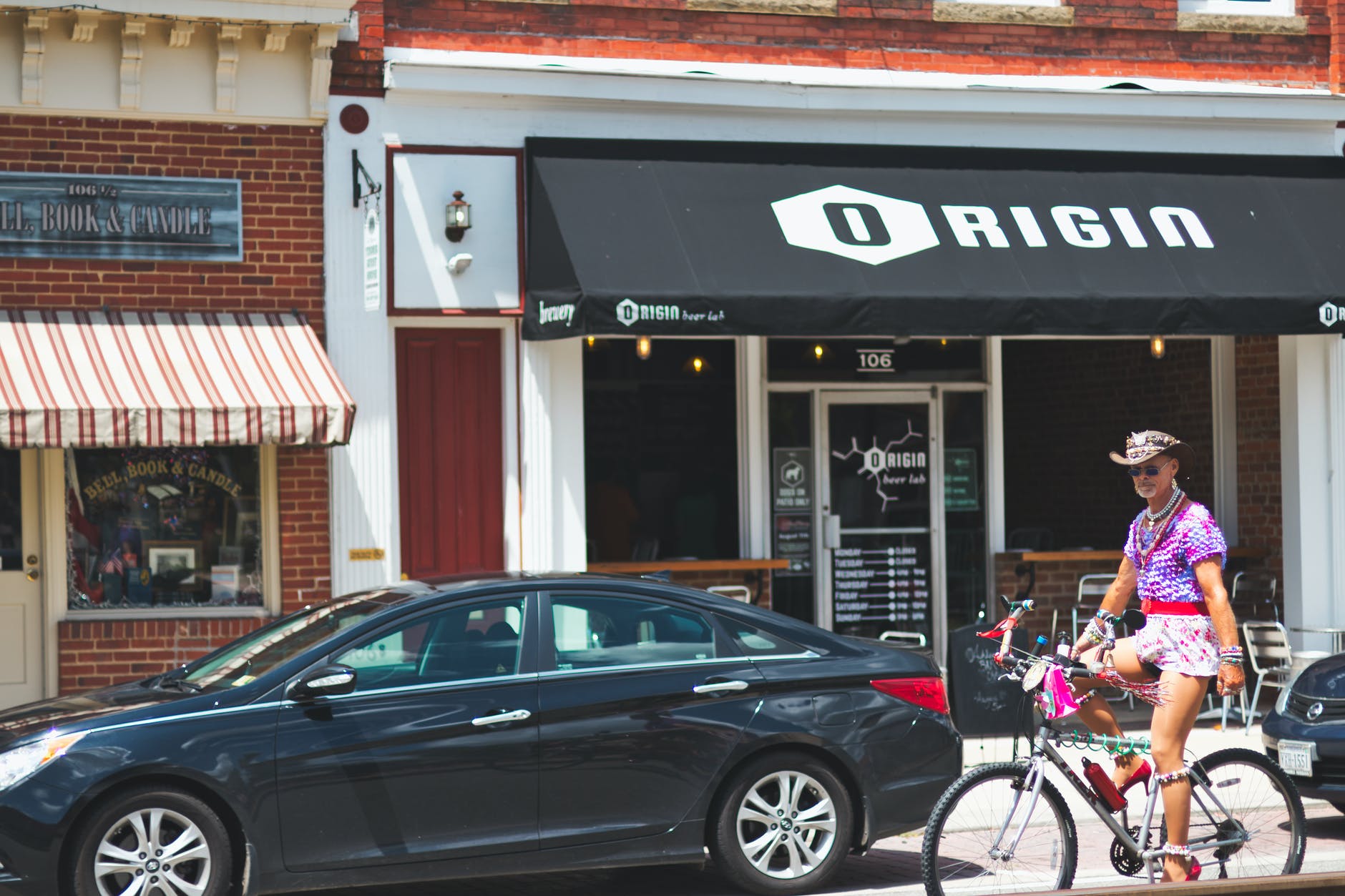 black hyundai sonata sedan parked beside building