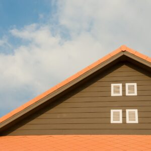 orange and gray painted roof under cloudy
