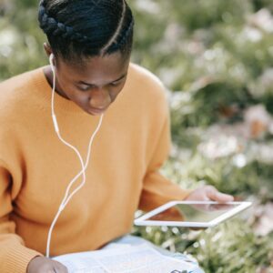 young black female student preparing for exams in park