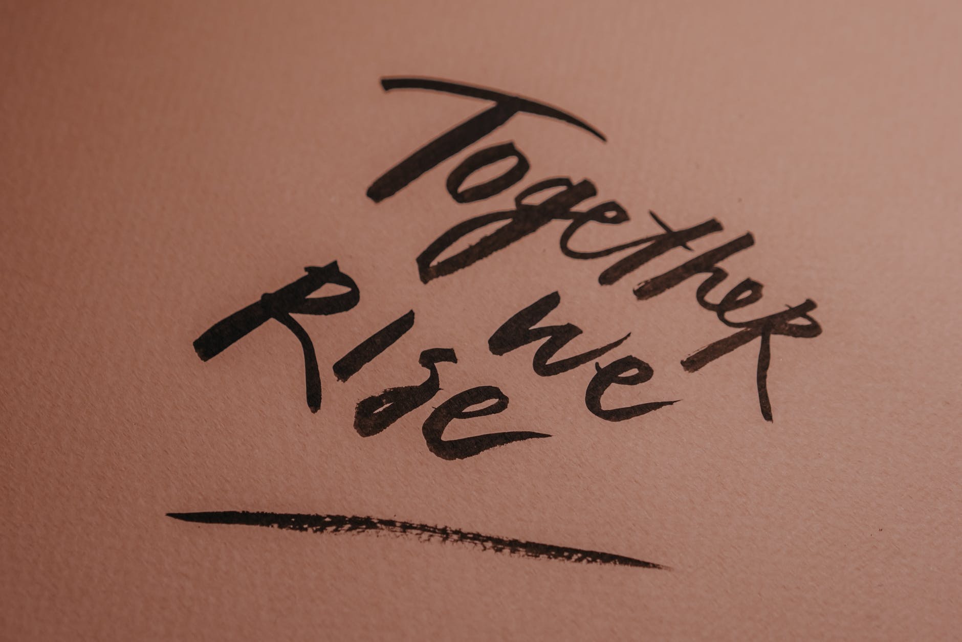 handwritten love people sand