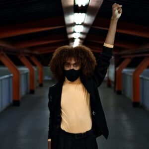 photo of man putting his hands up