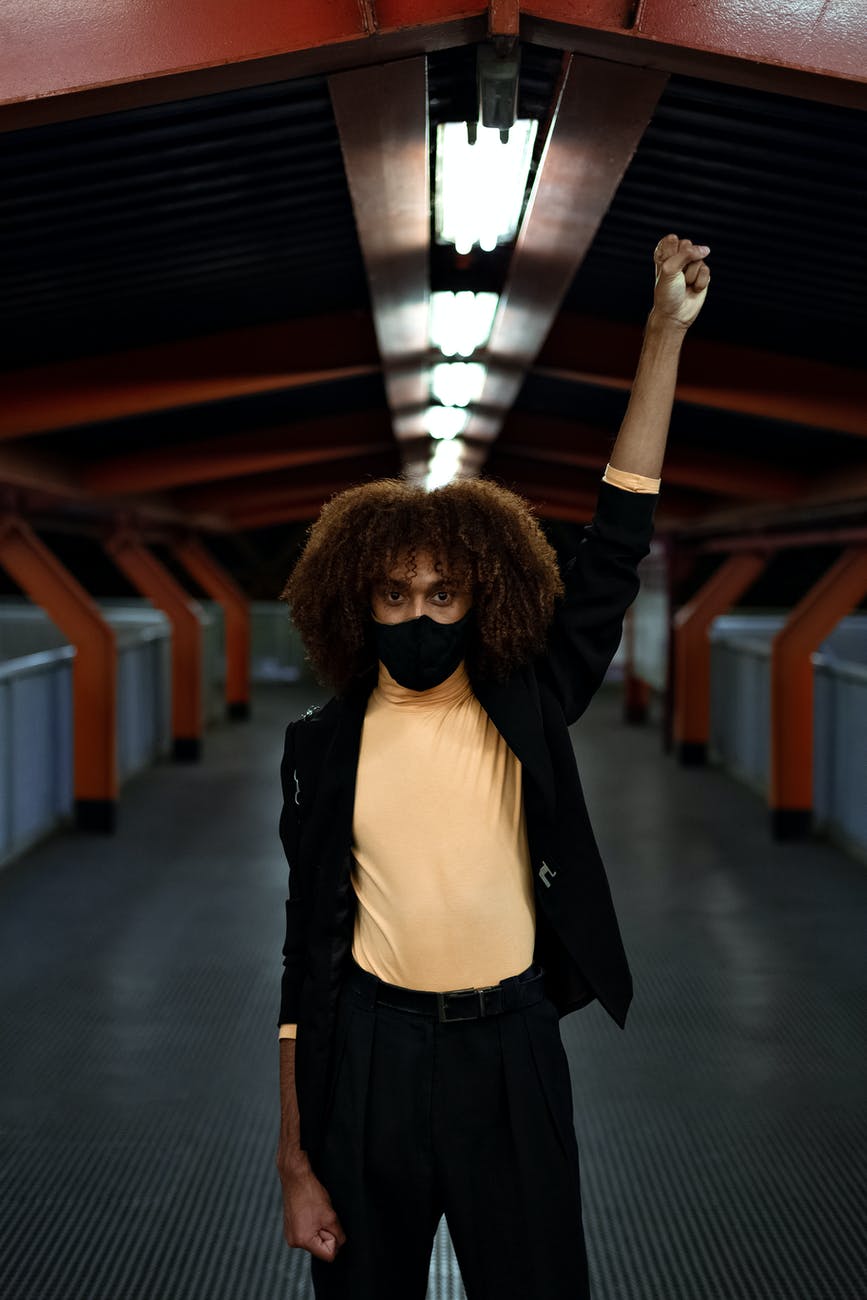 photo of man putting his hands up