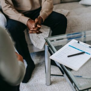 crop ethnic man in psychotherapy office