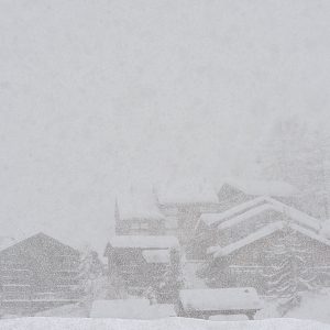 rural snowy village during severe blizzard