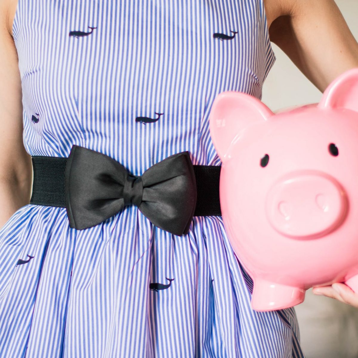 person holding a piggy bank