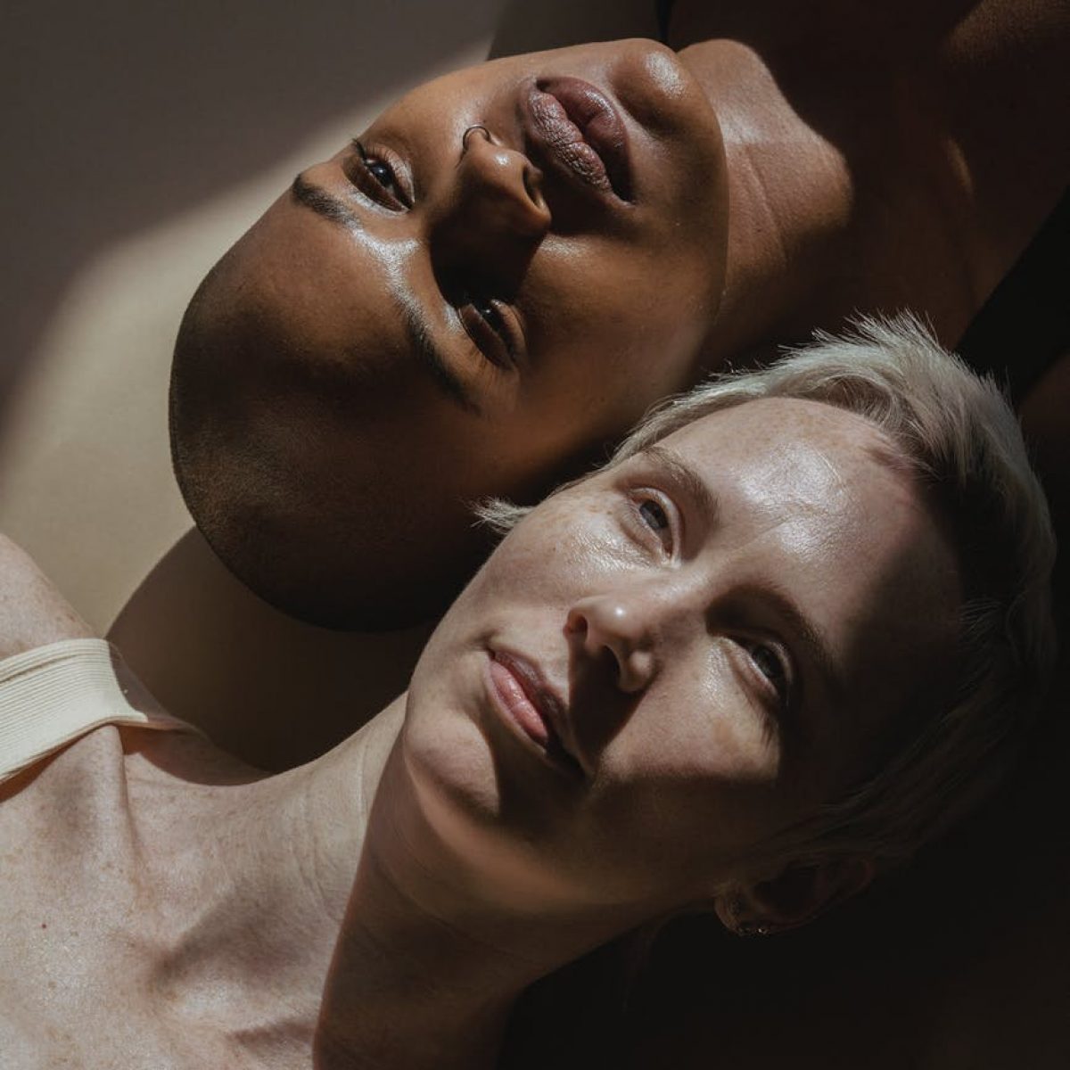 diverse women lying on floor