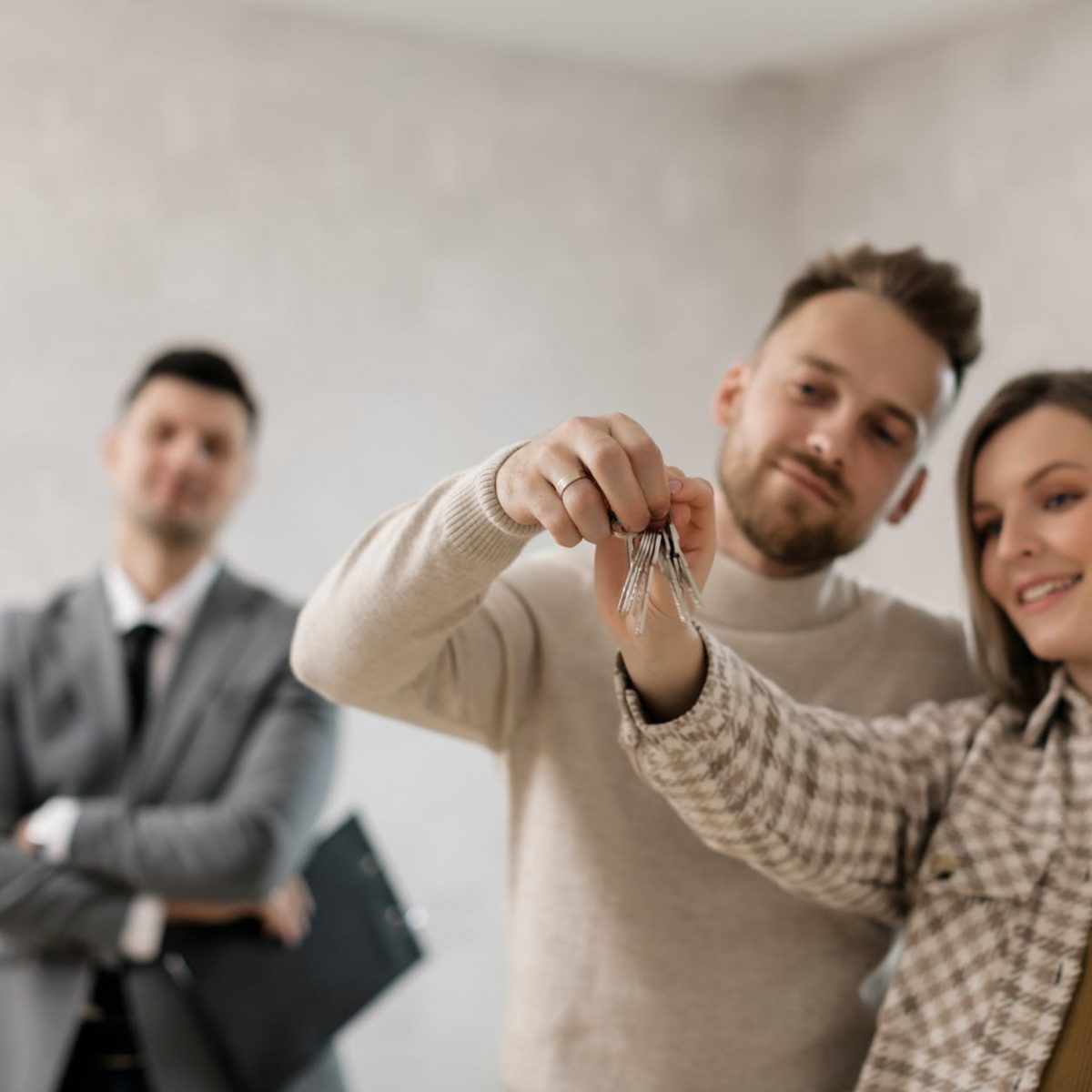 a couple holding their keys
