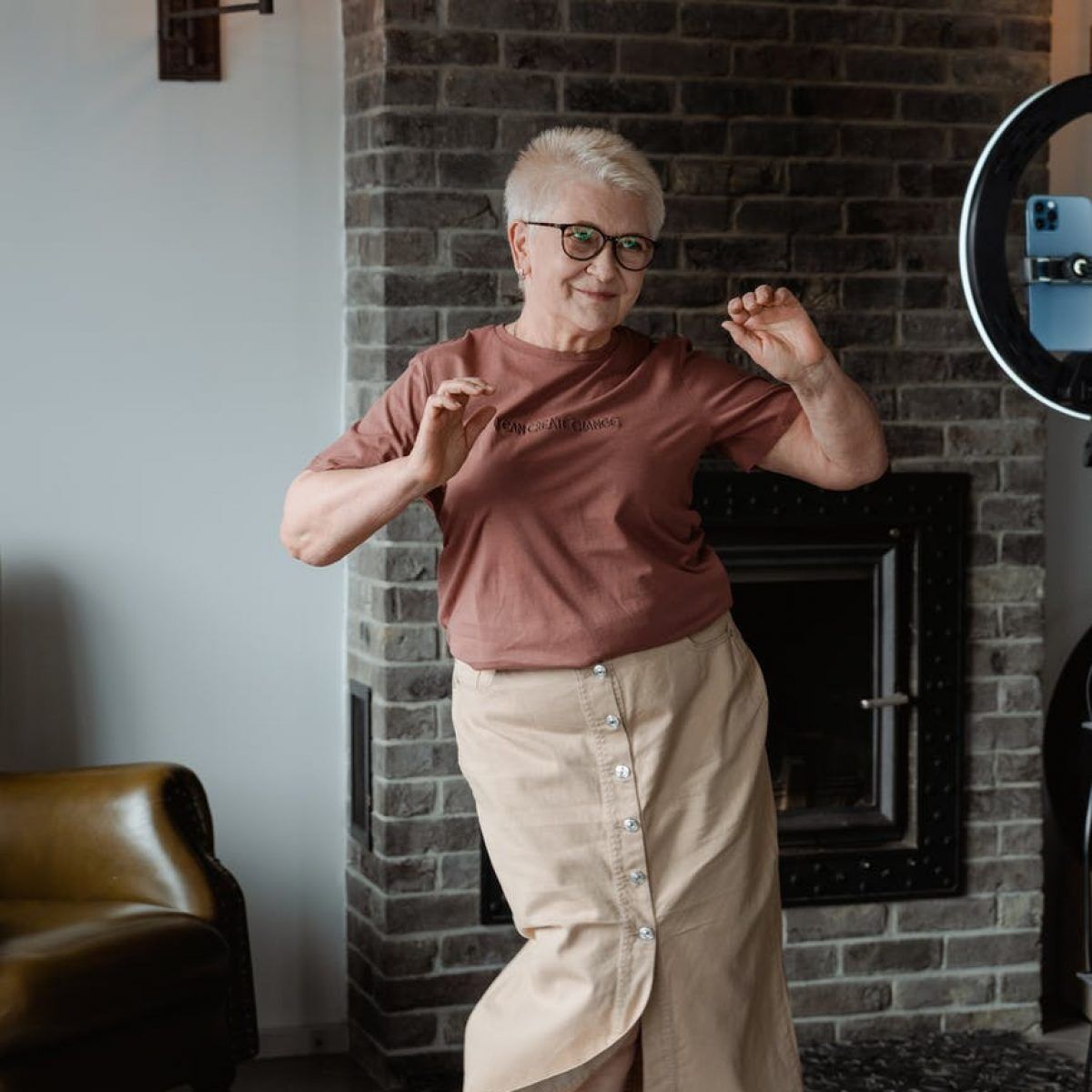 woman dancing in front of a phone