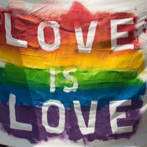 white and multicolored love is love banner