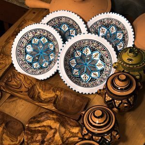 art photography of decorative plates and pots with lids