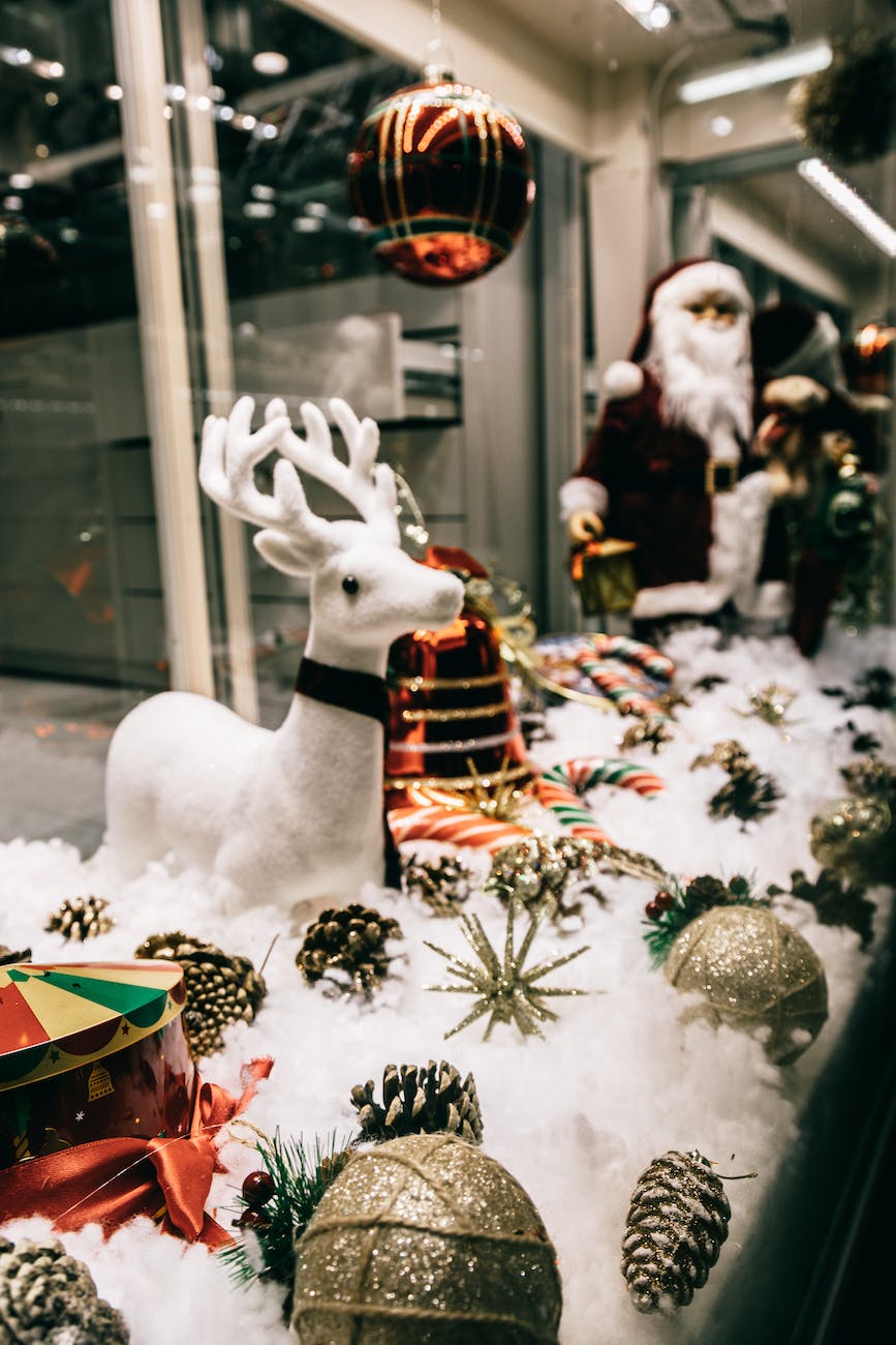 shop showcase festive decorations with shiny baubles and santa figurine