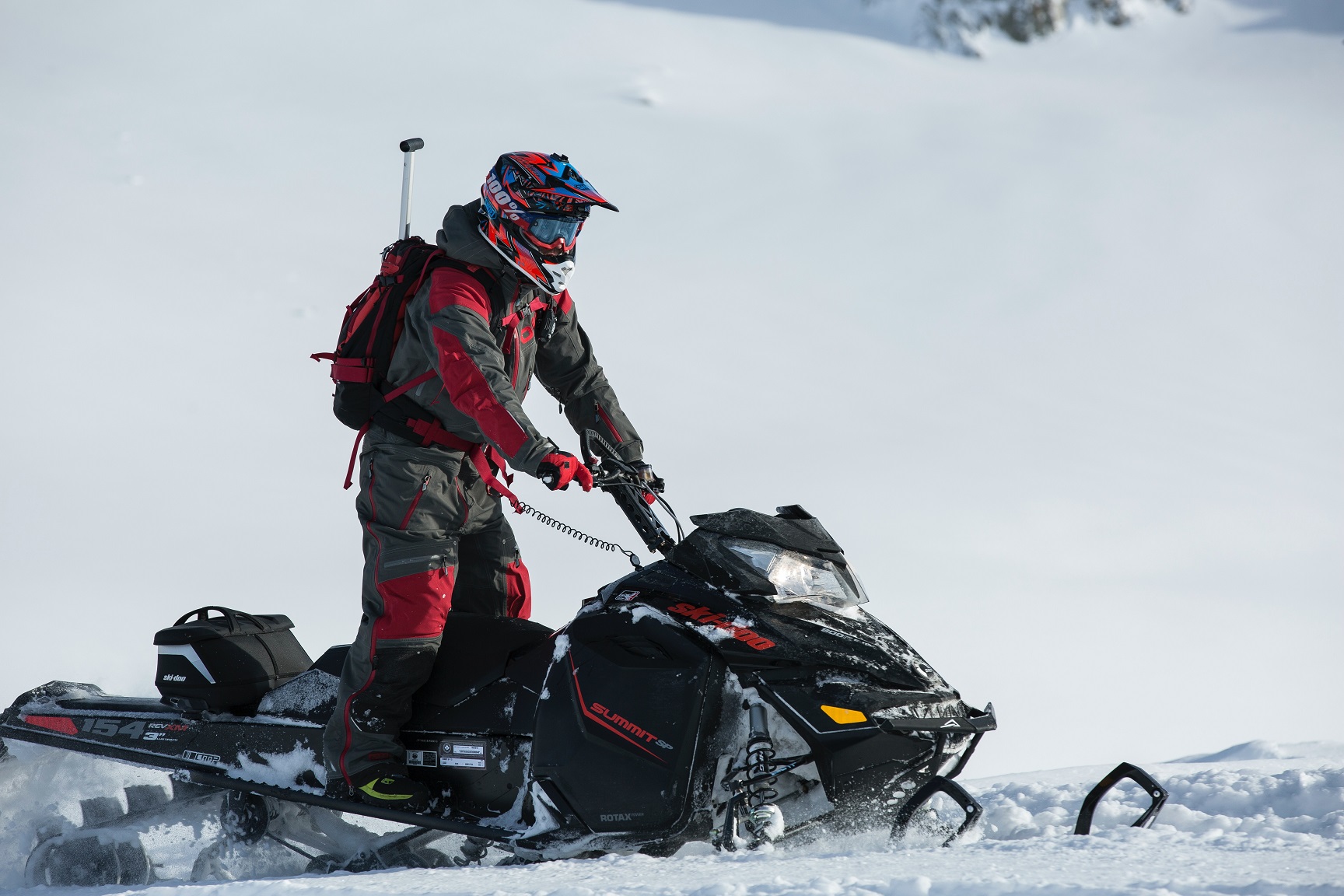 Person riding a snowmobile.