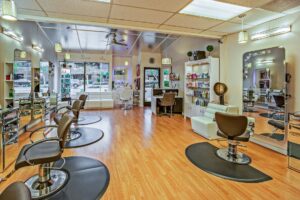 white and brown chairs inside a salon