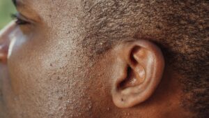 man s ear in close up photography