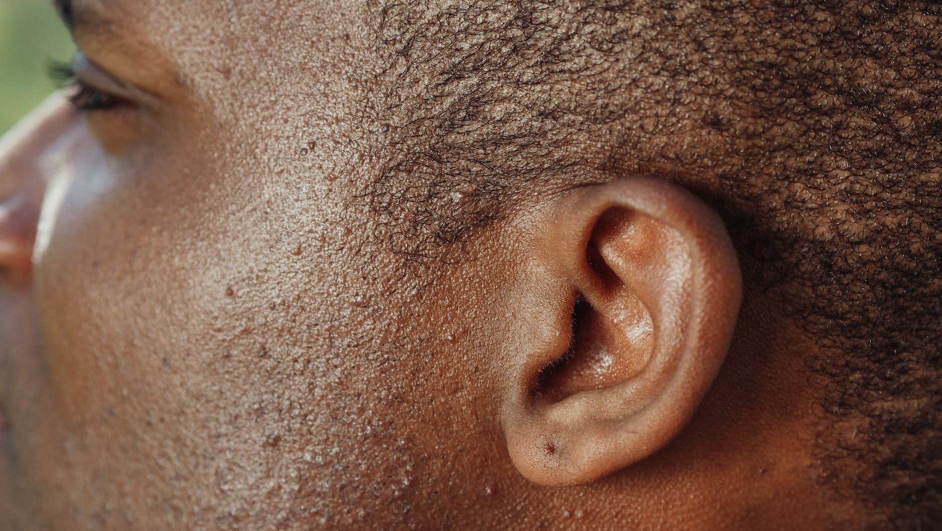 man s ear in close up photography