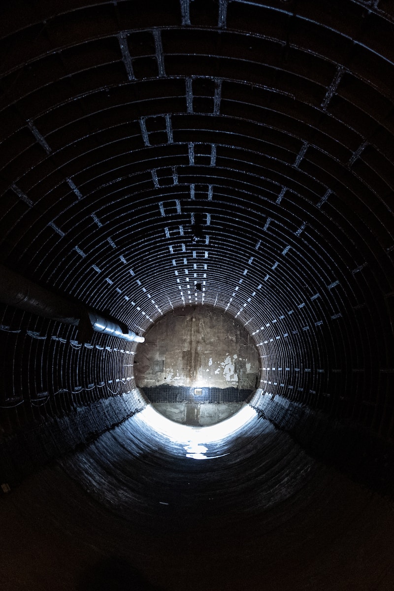 a dark tunnel with a light at the end