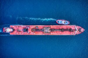aerial view of city buildings beside body of water during daytime