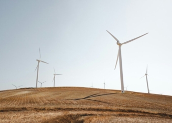 white electric windmills during daytime