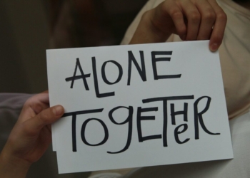 person holding white printer paper