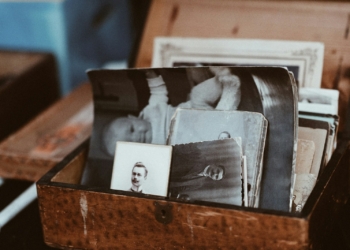 old photos in brown wooden chest