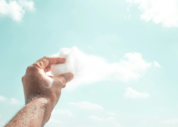 person holding white cotton candy