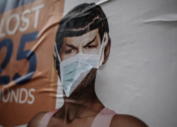 woman in white tank top wearing face mask