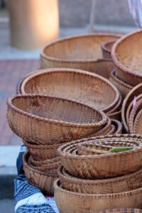 a pile of wicker baskets sitting on top of a table