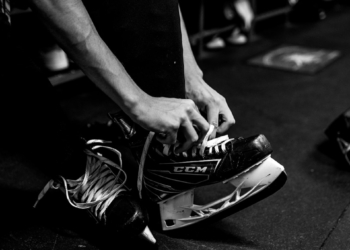 person wearing pair of ice skates