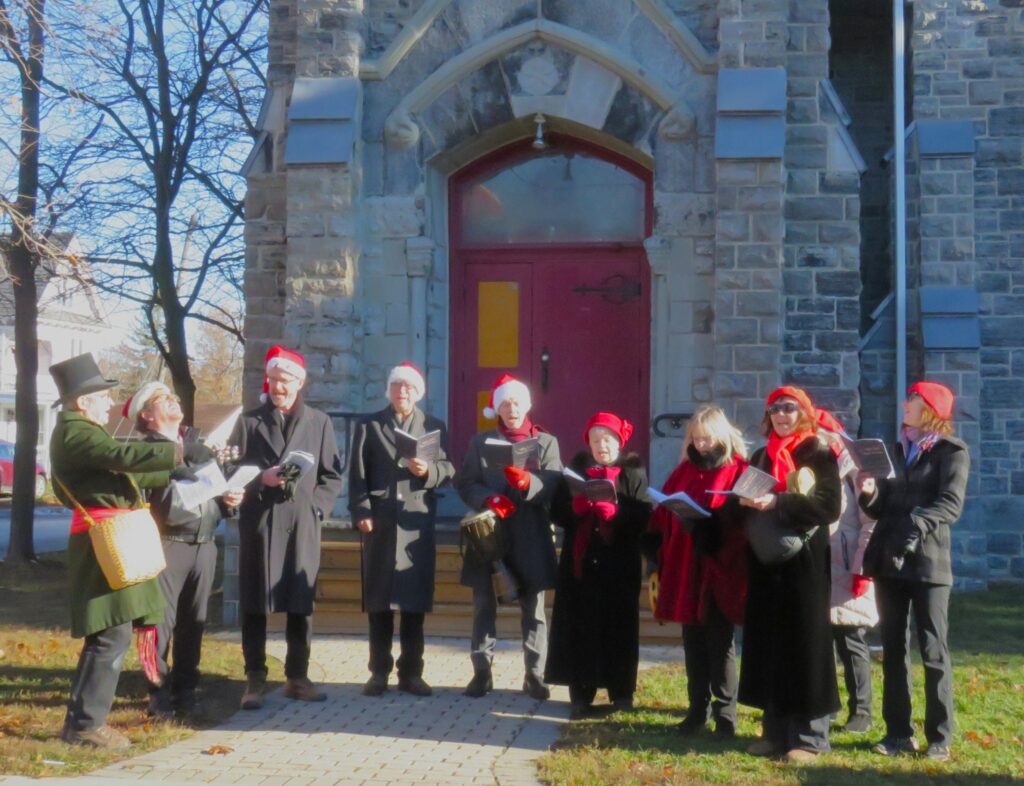A group of carolers outside of church