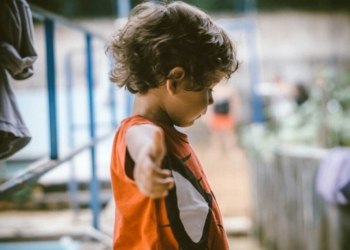 kid wearing deadpool shirt