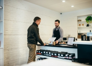 man buying item in shop